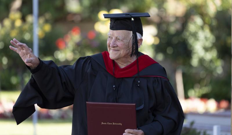 Judith Roach RSCJ, walks across the stage during her commencement ceremony at Santa Clara University. (Photo courtesy of Santa Clara University)