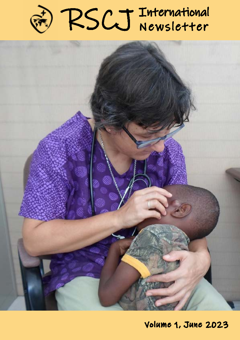 María del Valle Adame RSCJ cares for a child at the Centre de Santé Anna du Rousier in Balan, Haiti
